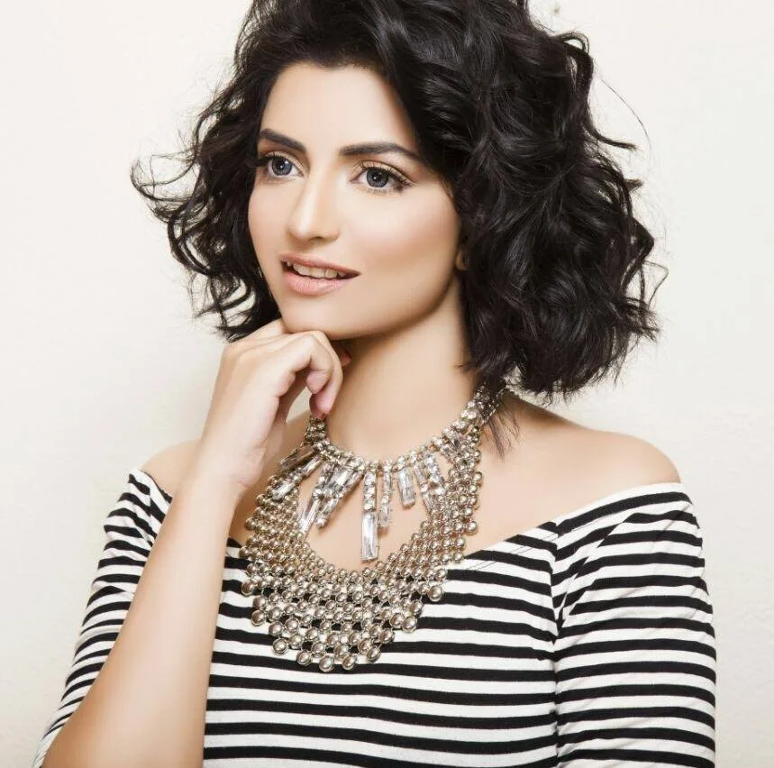 Beauty editorial with statement necklace and striped top