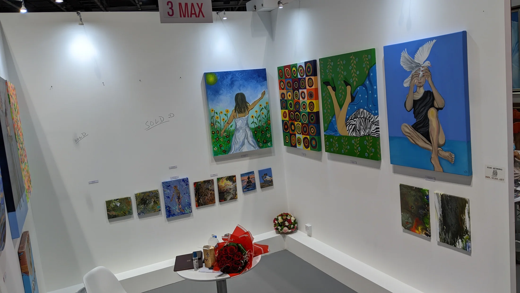 The Wabi Sabi stand at World Art Dubai, paintings hung on white walls